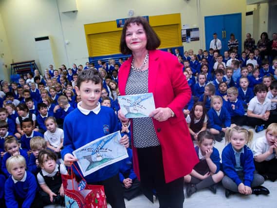 Burnley and Padiham MP Julie Cooper with Seth Davey (nine) who is the winner of her Christmas card competition for 2018.