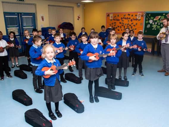 Ukulele students at Padiham Primary School are put through their paces by music tutor Phil Taylor-Fleming.