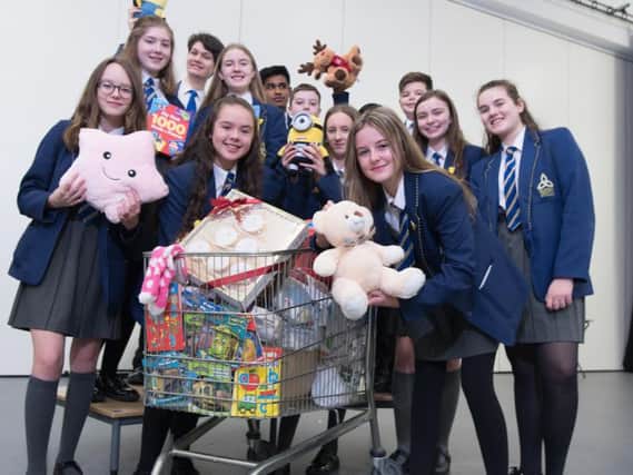 Blessed Trinity students with just some of the items they have donated to the charity Safenet.