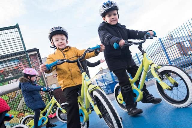 These two pupils are all set for cycling lessons at St Augustine's RC Primary School in Burnley.