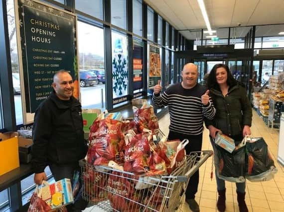 Paul Hacker with a trolley load of food ready to deliver to the needy