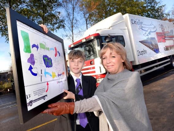Zak Walsh from Burnley High School with his specially commended design alongside former Senior Traffic Commissioner for Great Britain, Beverley Bell