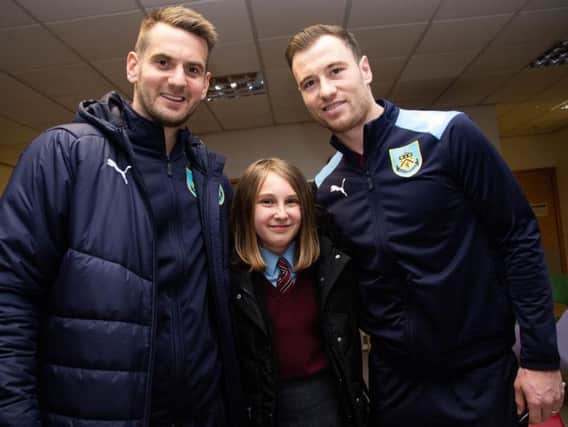 Tom Heaton and Ashley Barnes with a young fan