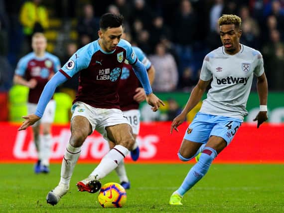 Burnley's Dwight McNeil takes on West Ham United's Grady Diangana