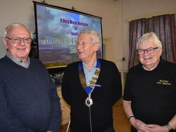 Pendleside Probus president Alan Riley (middle) with members of Burnley Film Club