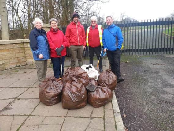 Some of the volunteers with the bags of rubbish they collected during a litter pick around the Ightenhill area of Burnley