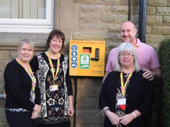 From left to right: Sally Francis (senior human resources officer), Bridie Ainsworth (human resources administrator),LeoNoctor (learning and development coordinator) and Sue Woof (purchase ledger clerk) with the CANW defibrillator.