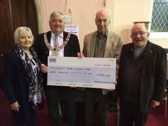 Maureen Brown from the committee, Ribble Valley Mayor Coun. Stuart Carefoot, concert organiser Barry Brown and the Rev. Jim Corrigall pictured with the cheque