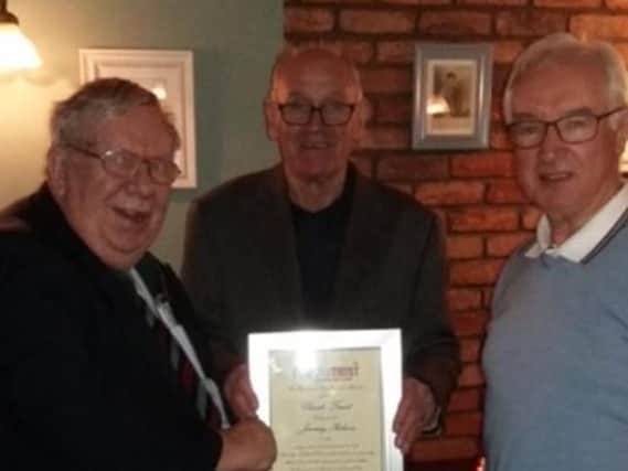 Jimmy Robson stood with Clarets Trust chairman Peter Pike and Terry Hephrun.