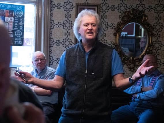 Tim Martin addresses locals at The Boot Inn, Burnley