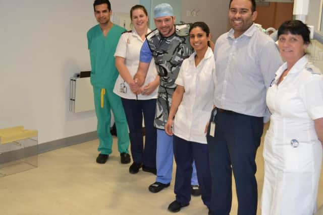 Adam is the pride of his colleagues who are (left to right) (Dr. Mohammad Nazir, Sara Warburton, Jess Dholakia, Paul Venguedasalon and Julie Moorby