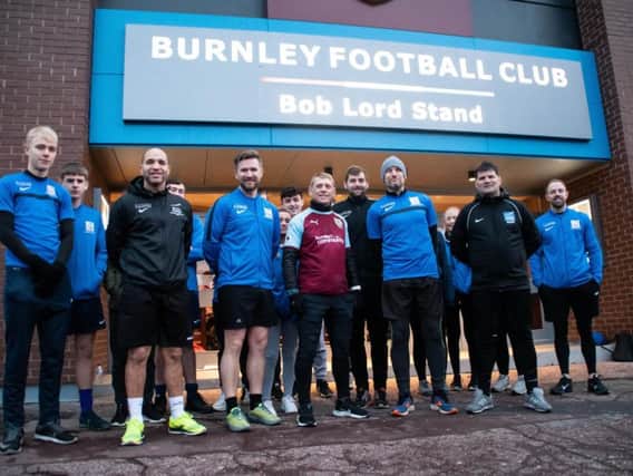 Burnley shirt wearing Scott Cunliffe with his fellow runners outside Turf Moor