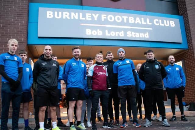 Burnley shirt wearing Scott Cunliffe with his fellow runners outside Turf Moor