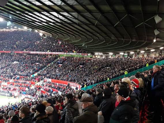 Burnley fans in the away end at Old Trafford