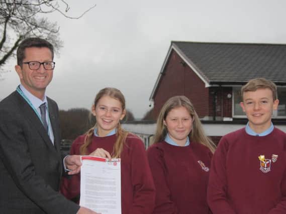 Mr Wright with the letter of congratulations from Lancashires Interim Executive Director for Education, John Readman.