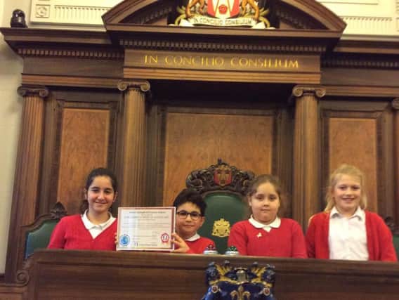 Pupils from Earby Springfield Primary School with their special award for being so welcoming.