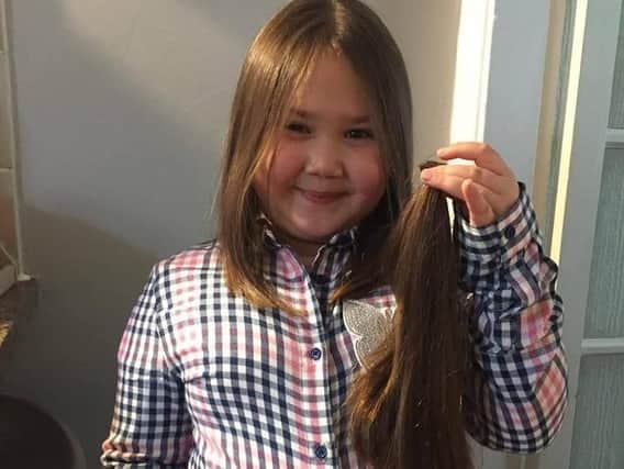 Emily Pickles (seven) had 12 inches of her hair lopped off for the Little Princess charity.