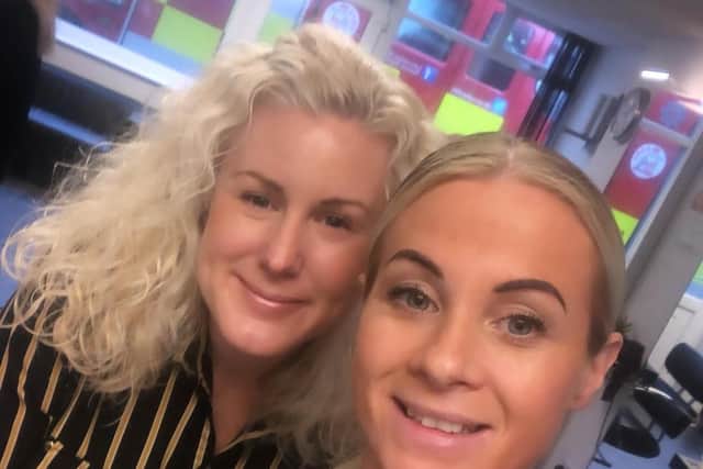 Hairdressers Vicky Holland (back) and Jodie Forrest are back at work in the Vanilla hair salon today after last night's fire drama.