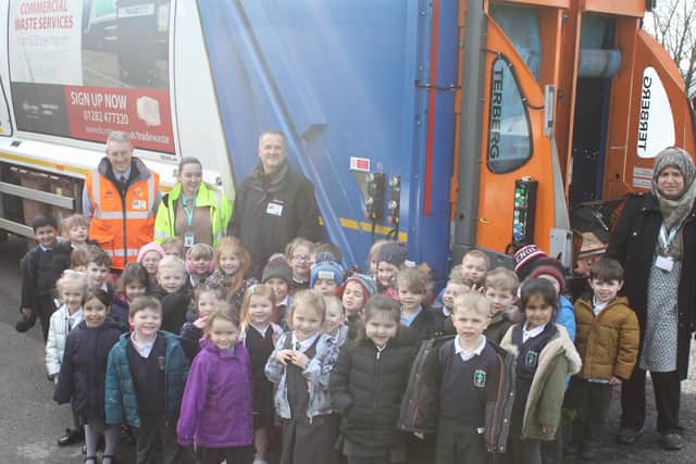 The children learning about bin collections