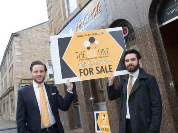 Luke Robinson and Matthew Hargreaves with The Bee Hives new-look board. (s)