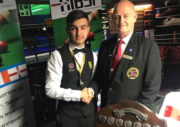 Burnley snooker star Lewis Ullah (left) is presented with the Home Internationals shield