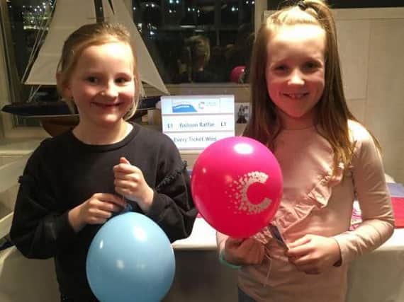 Two Pendle youths with their balloons from a raffle at a charity Beetle drive in aid of cancer research at Banny's Restaurant, Colne. (s)