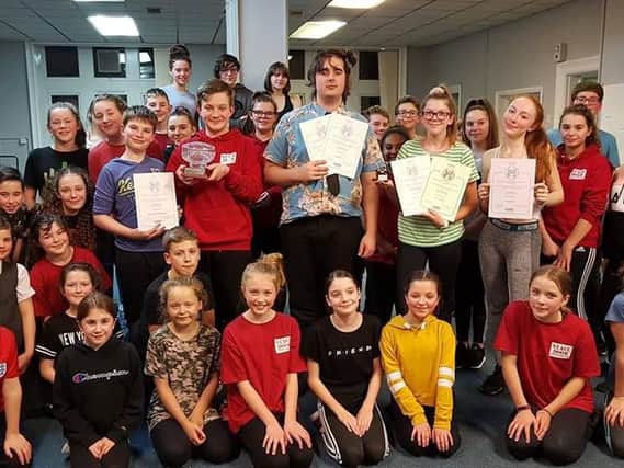 Members of Stage Door Youth Theatre with their certificates from the National Dramatic and Operatic Association. (s)