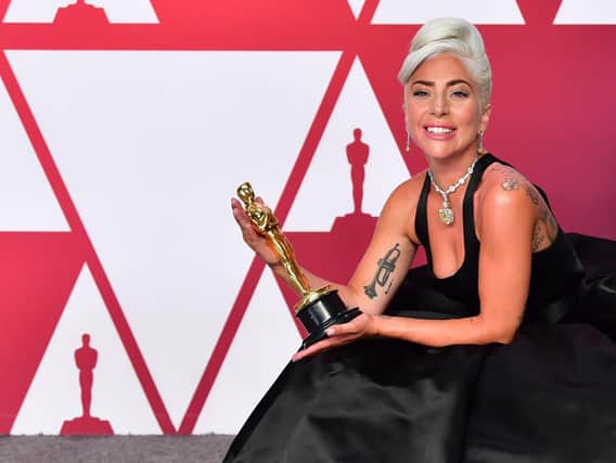 Lady Gaga with her Academy Award. Best Original Song winners for "Shallow" from "A Star is Born" Lady Gaga poses in the press room with the Oscar during the 91st Annual Academy Awards at the Dolby Theater in Hollywood, California on February 24, 2019. (Photo by FREDERIC J. BROWN / AFP)        (Photo credit should read FREDERIC J. BROWN/AFP/Getty Images)