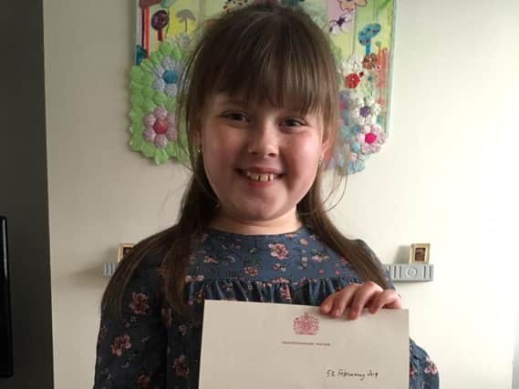 Jessica Thornber with her letter of thanks from Her Majesty the Queen
