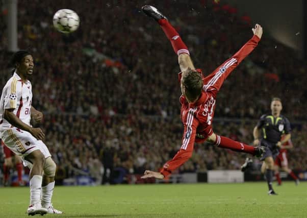 LIVERPOOL, UNITED KINGDOM - SEPTEMBER 27:  Peter Crouch (R) of Liverpool scores his team's third goal during the UEFA Champions League group C match between Liverpool and Galatasaray at Anfield on September 27, 2006 in Liverpool, England.  (Photo by Alex Livesey/Getty Images)