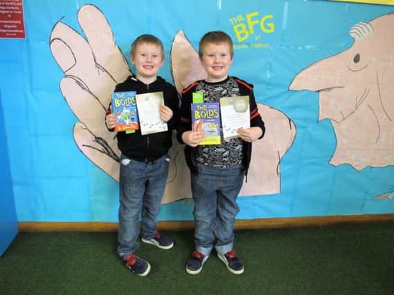 Twins Freddie and Frankie Knight (five)have both read and reviewed 50 books to complete the Lancashire Reading Trail together at Nelson Library. (s)