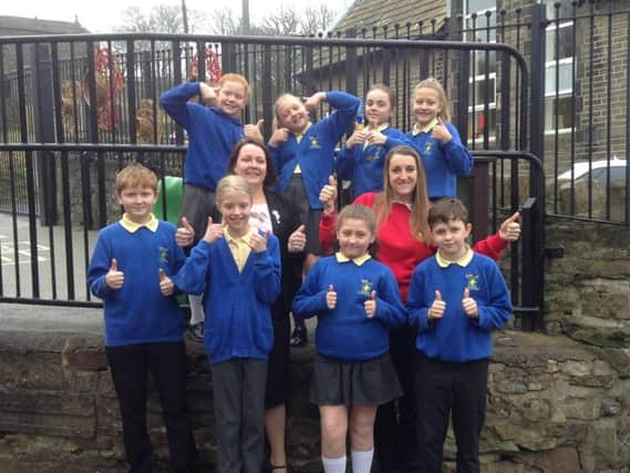 Pupils from St John's Primary, Cliviger, celebrate the school's 'excellent' rating