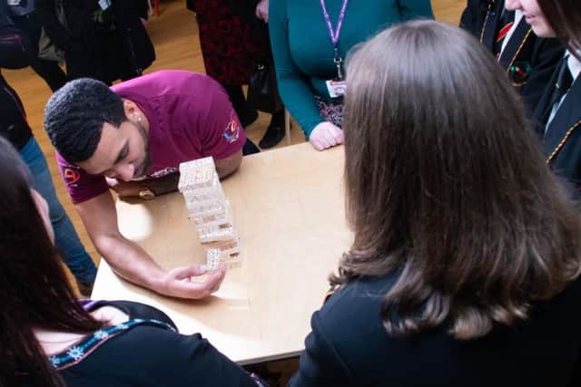 Burnley winger Aaron Lennon taking part in a mental health exercise with students.