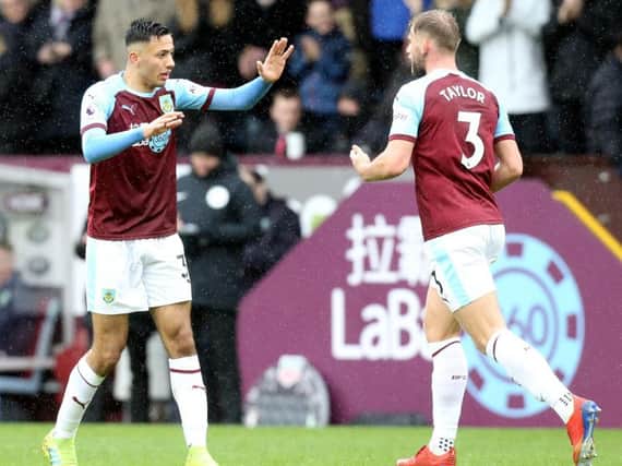 Burnley's Dwight McNeil (left) celebrates with team-mate Charlie Taylor after scoring his side's equalising goal to make the score 1-1