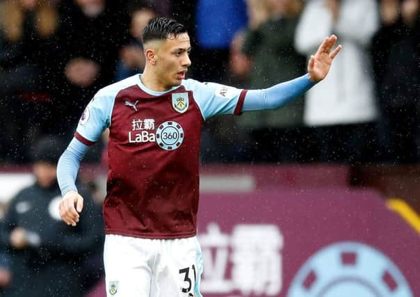 Burnley's Dwight McNeil celebrates scoring his side's first goal of the game during the Premier League match at Turf Moor, Burnley. PRESS ASSOCIATION Photo. Picture date: Saturday March 16, 2019. See PA story SOCCER Burnley. Photo credit should read: Martin Rickett/PA Wire. RESTRICTIONS: EDITORIAL USE ONLY No use with unauthorised audio, video, data, fixture lists, club/league logos or "live" services. Online in-match use limited to 120 images, no video emulation. No use in betting, games or single club/league/player publications.