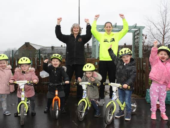 Sarah Darcy (right) and head teacher Gail Murphy with some of the youngsters at Taywood Nursery School who have taken part in the bike scheme.