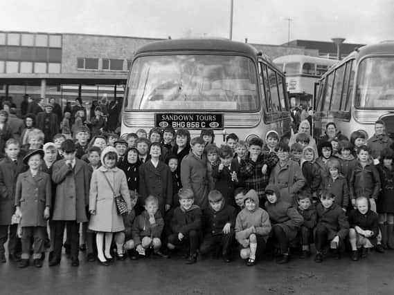 Children of Prestige Limited employees gather outside the Cattle Market/bus station on December 30th, 1966, ready for a day trip to Belle Vue Circus.