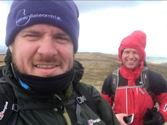 Andy (front) with his pal Stewart Bromwich after they completed the walk from Worsthorne to the top of Pendle Hill for World Kidney Day.