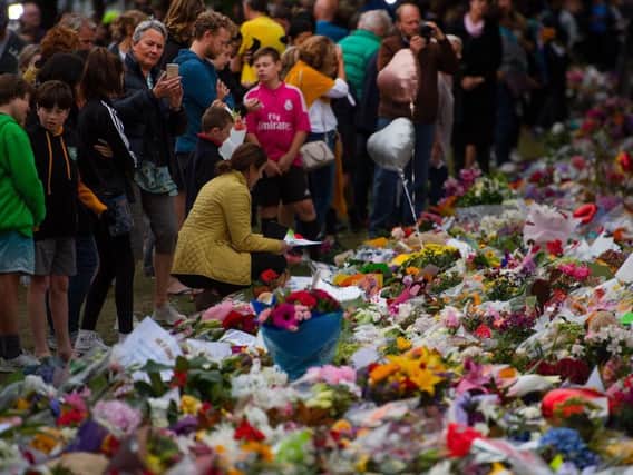 People pay their respects at a memorial site at the Botanical garden in Christchurch three days after a shooting incident at two mosques in the city that claimed the lives of 50 Muslim worshippers. Photo: Getty