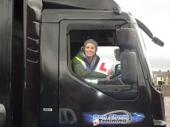 Laura Nuttall behind the wheel of the DAF truck