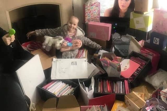 Tia surrounded by her birthday cards and gifts