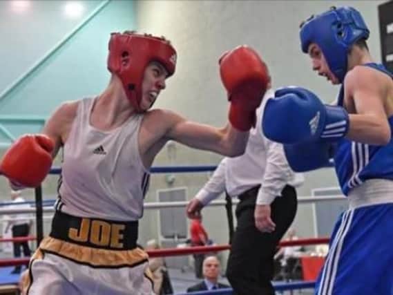 Burnley boxer, Joe Crawford (16) on the left.