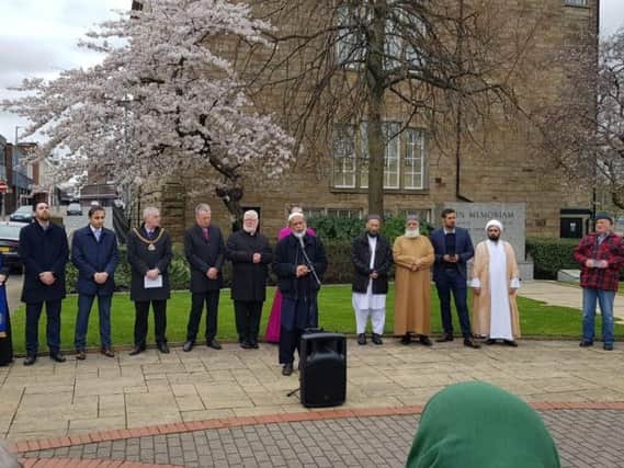 Civic and religious leaders lead the service