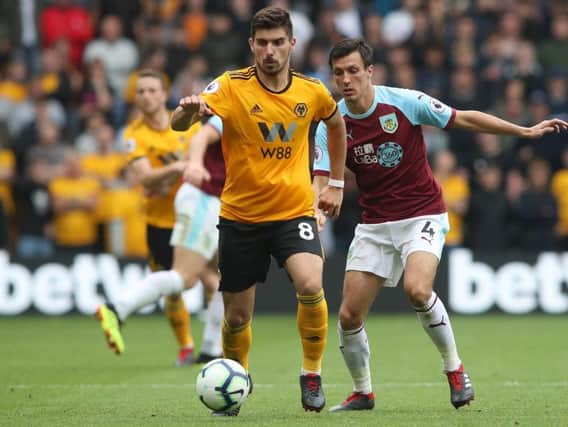 Burnley's Jack Cork keeps a close eye on Ruben Neves at Molineux earlier in the season.