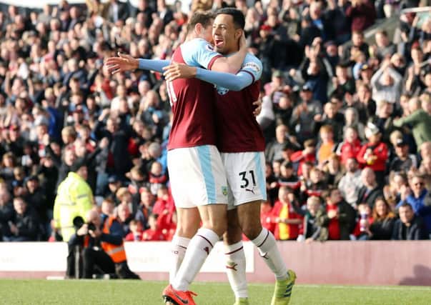 Burnley's Dwight McNeil (right) celebrates with team-mate Chris Wood after scoring his side's second goal 

Photographer Rich Linley/CameraSport

The Premier League - Burnley v Wolverhampton Wanderers - Saturday 30th March 2019 - Turf Moor - Burnley

World Copyright © 2019 CameraSport. All rights reserved. 43 Linden Ave. Countesthorpe. Leicester. England. LE8 5PG - Tel: +44 (0) 116 277 4147 - admin@camerasport.com - www.camerasport.com