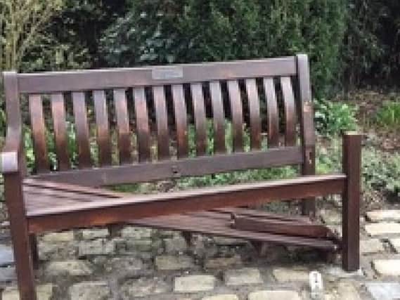 This memorial bench in the village has been vandalised recently. (s)