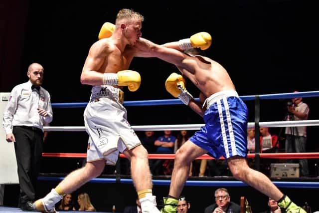 Debutant Josh Holmes slips another shot from Naheem Chaudhry at King George's Hall