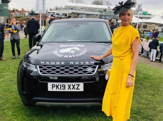 Glamorous Sue Moon in her stunning outfit and the winner of a Range Rover Evoque