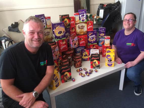 Anthony and Starvin' Marvin assistant manager Carlene Jackson pictured with some of the Easter eggs donated to their appeal.