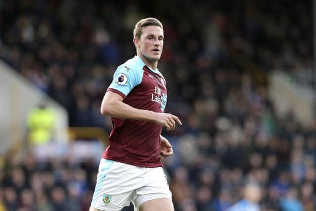 Chris Wood scored twice as the Clarets edged closer to Premier League safety